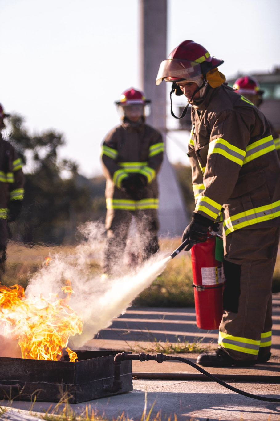 firefighter putting out fire - fire risk assessments